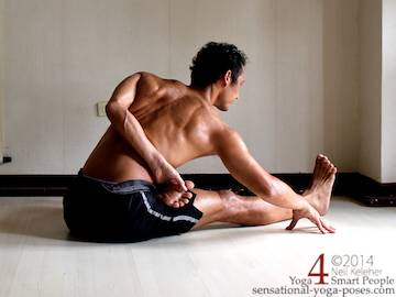 Half Lotus Bound Bending Forwards half bound lotus seated forward bend (ardha baddha padmo paschimottanasana). Right foot is in lotus and bound with the right hand. Left hand is grabbing the left big toe. Torso is tilted forwards at the hips. Neil Keleher. Sensational Yoga Poses.